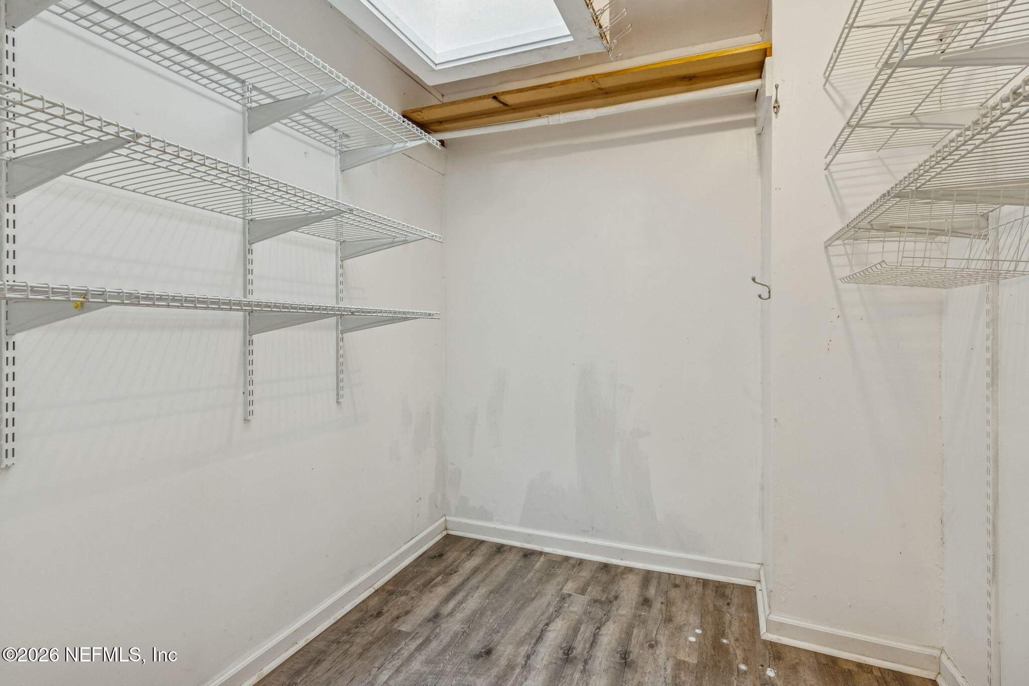 8528 Moody Canal Road St. Augustine, FL 32092 - Photo 24 of 61 a view of small space with racks on the wall