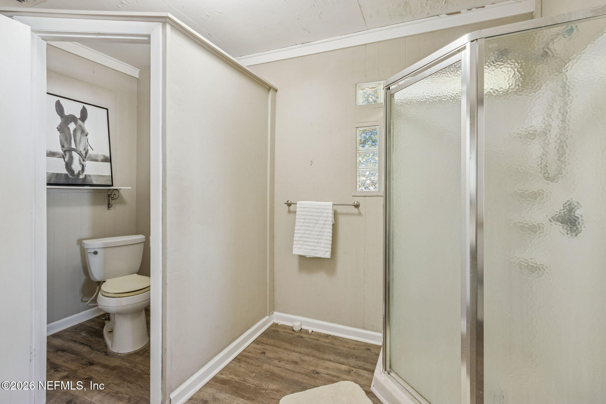 8528 Moody Canal Road St. Augustine, FL 32092 - Photo 28 of 61 a bathroom with a toilet and a shower