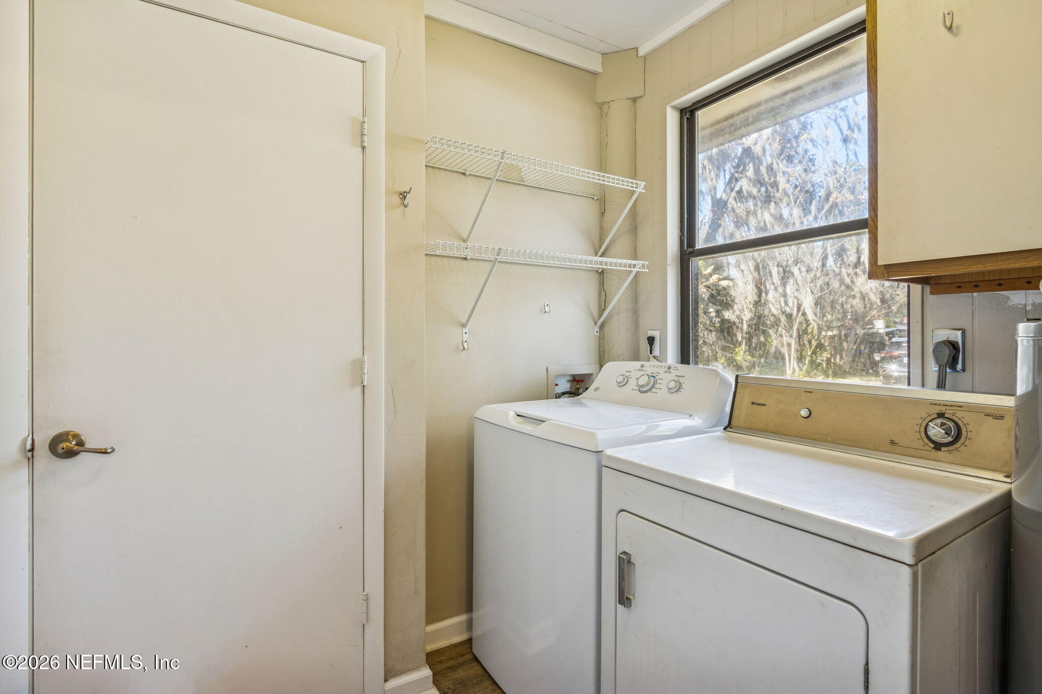 8528 Moody Canal Road St. Augustine, FL 32092 - Photo 29 of 61 a utility room with dryer and washer