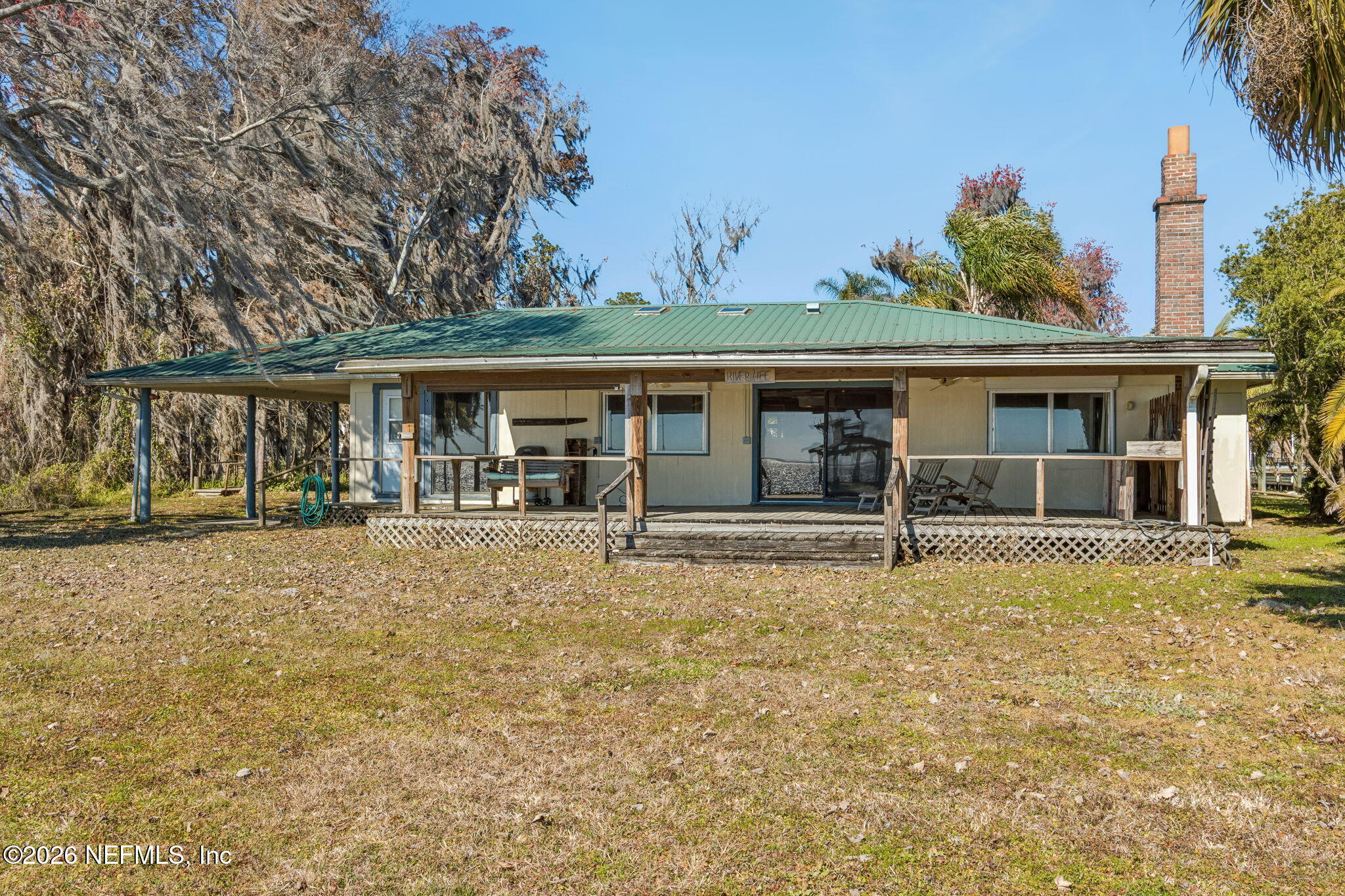 8528 Moody Canal Road St. Augustine, FL 32092 - Photo 34 of 61 front view of a house with a yard