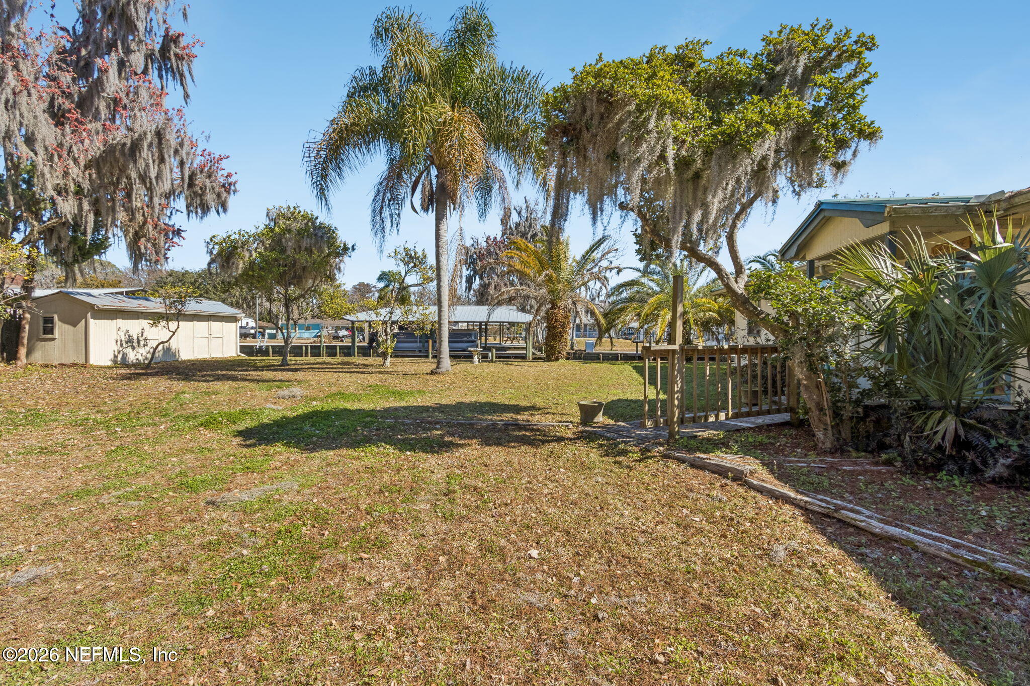 8528 Moody Canal Road St. Augustine, FL 32092 - Photo 36 of 61 a backyard of a house with lots of green space