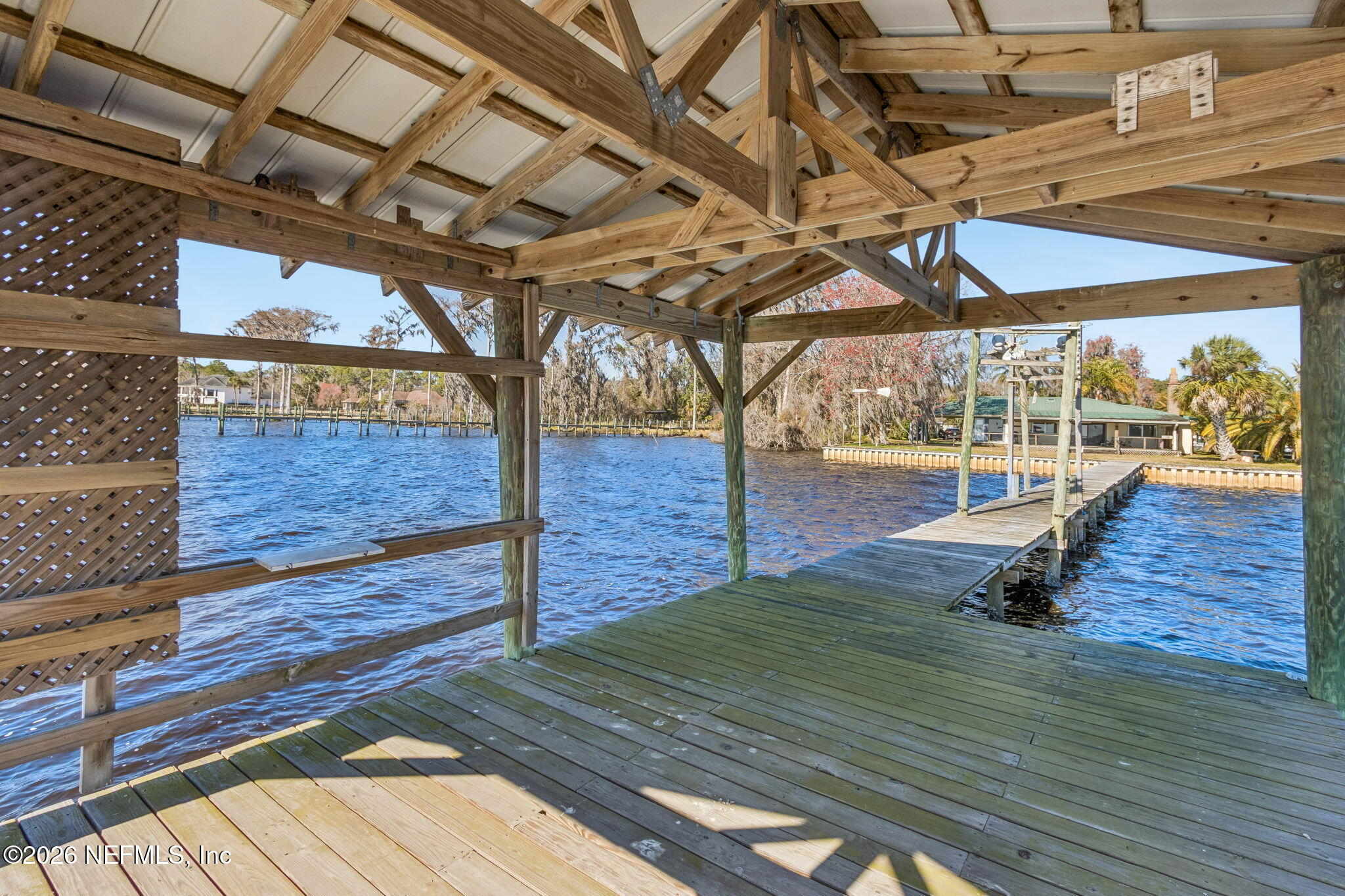8528 Moody Canal Road St. Augustine, FL 32092 - Photo 41 of 61 a view of a swimming pool with wooden floor