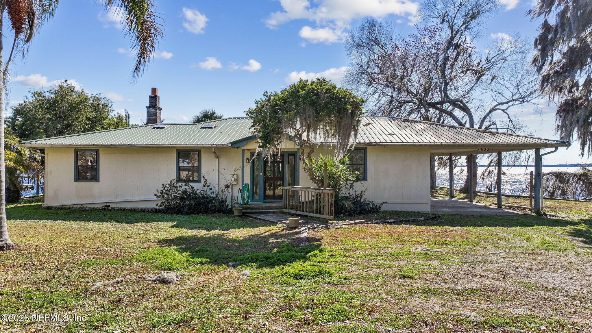 8528 Moody Canal Road St. Augustine, FL 32092 - Photo 47 of 61 a view of a house with a yard and plants