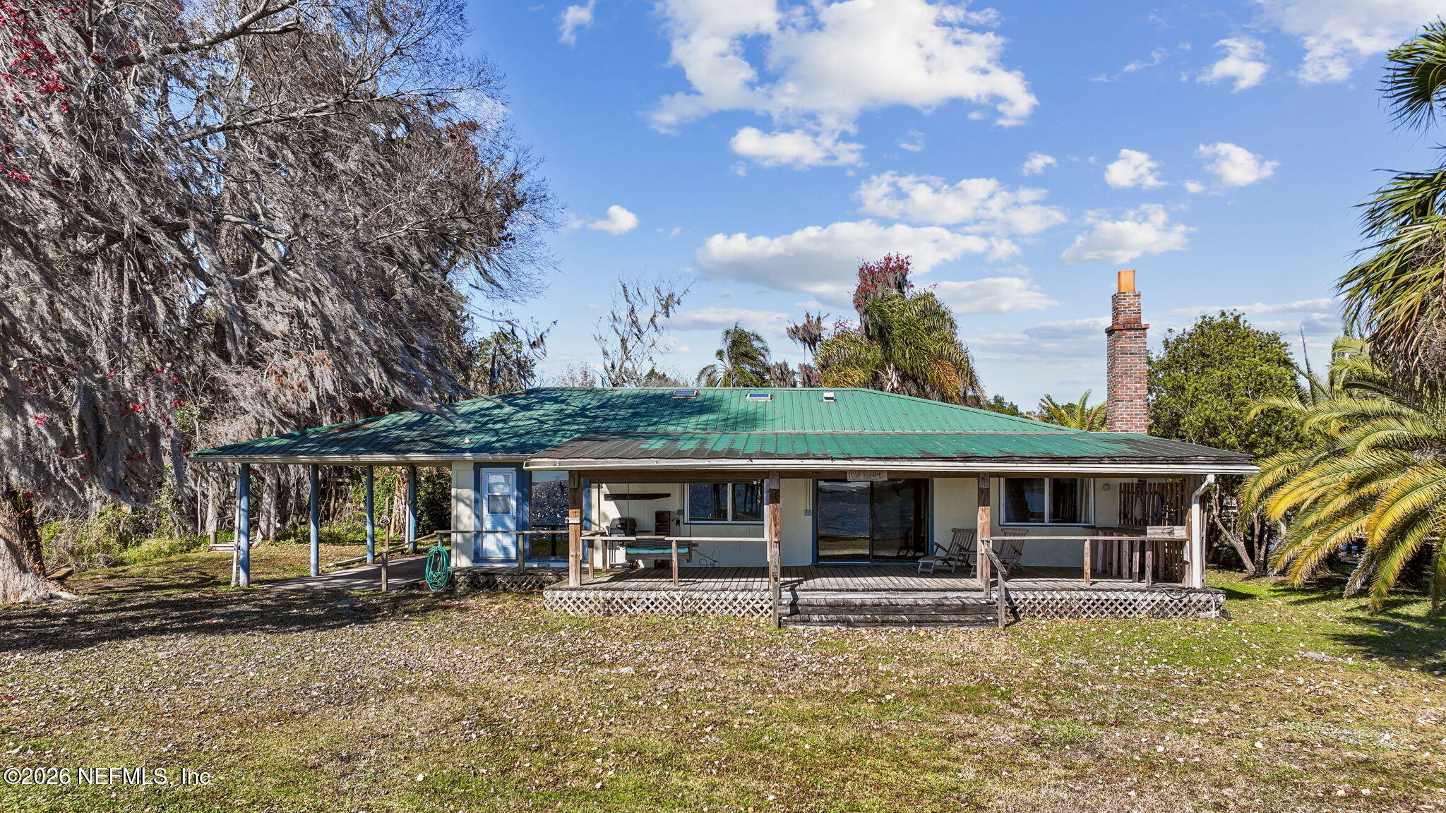8528 Moody Canal Road St. Augustine, FL 32092 - Photo 57 of 61 a front view of a house with garden