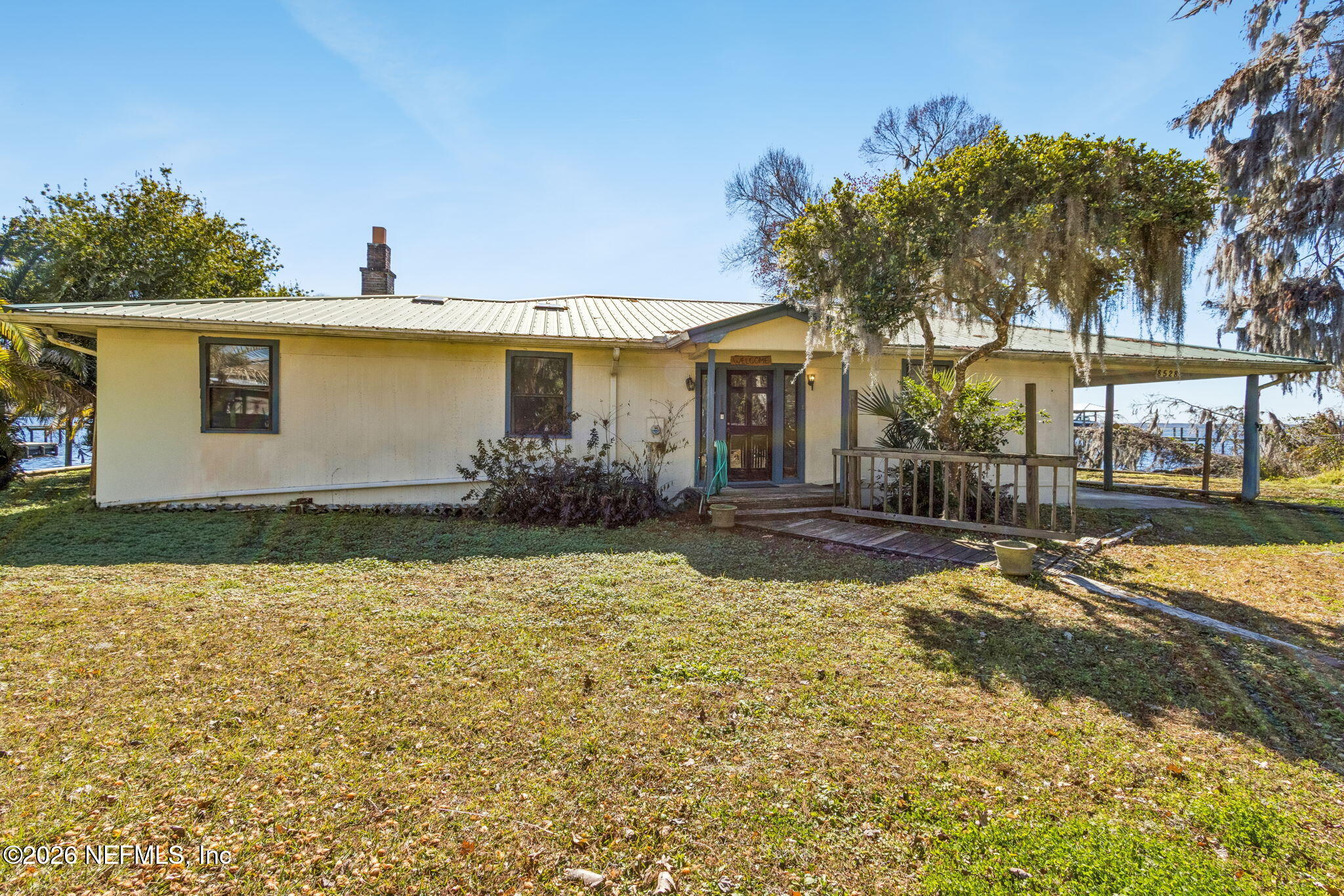 8528 Moody Canal Road St. Augustine, FL 32092 - Photo 58 of 61 a view of a house with snow on the ground