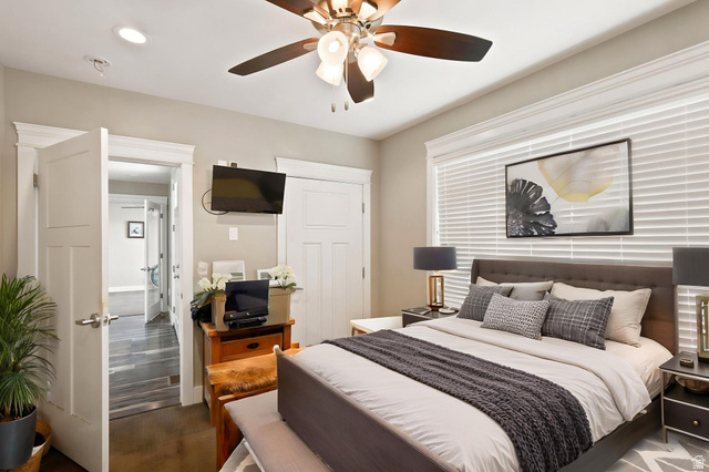 580 North 300 East Logan, UT 84321 - Photo 55 of 74 Exterior access bedroom featuring a ceiling fan with integrated lighting, recessed lighting, and a window with blinds