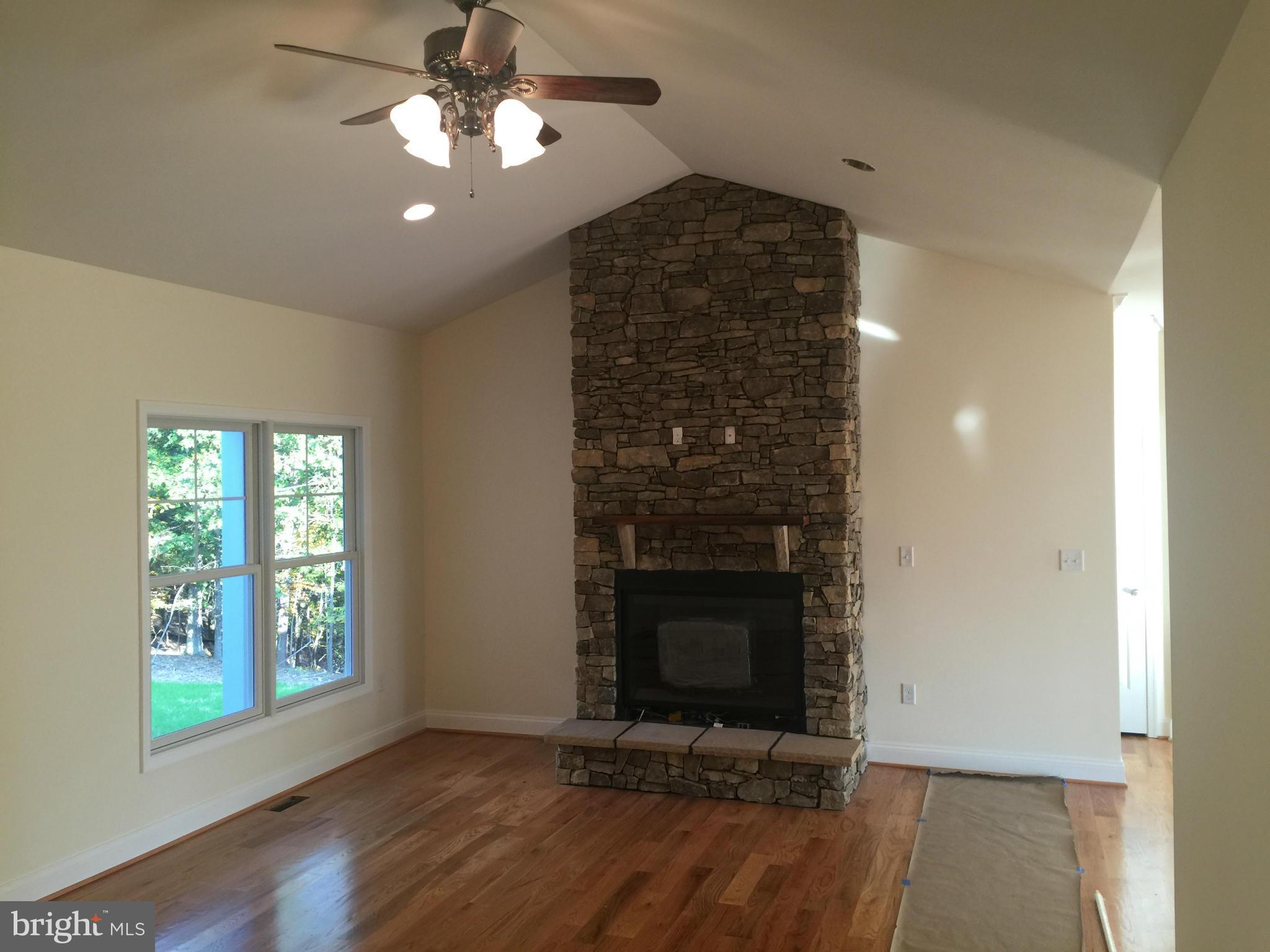 877 Adams Road Winchester, VA 22603 - Photo 5 of 27 Vaulted Great Rm w/ Stacked Stone FP