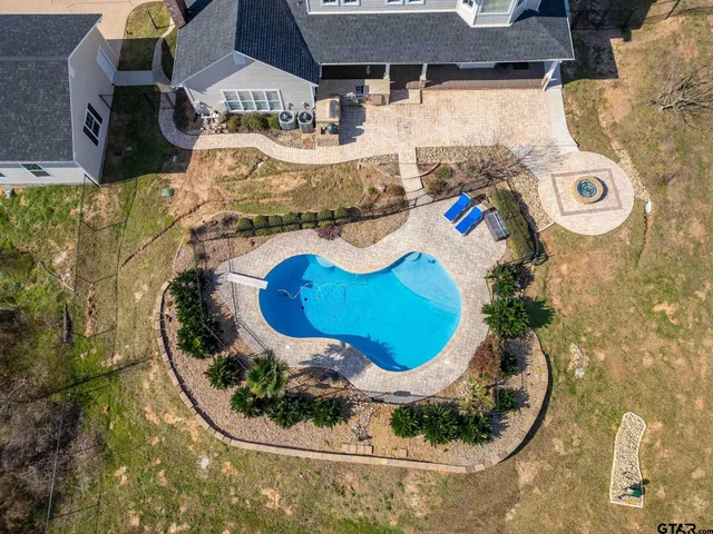 a front view of house with yard outdoor seating and barbeque oven