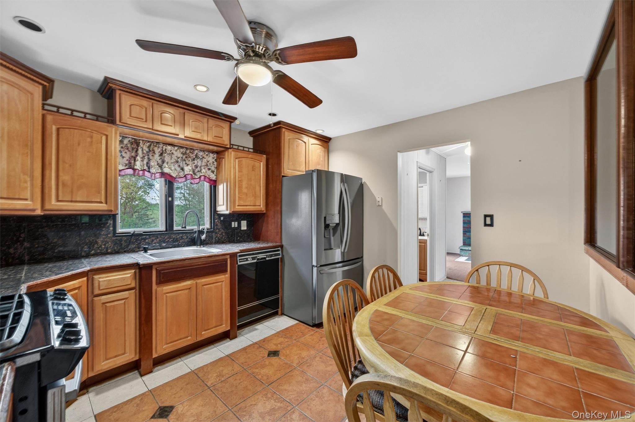 155 Pine Tree Road Monroe, NY 10950 - Photo 12 of 49 a kitchen with stainless steel appliances granite countertop a sink and cabinets