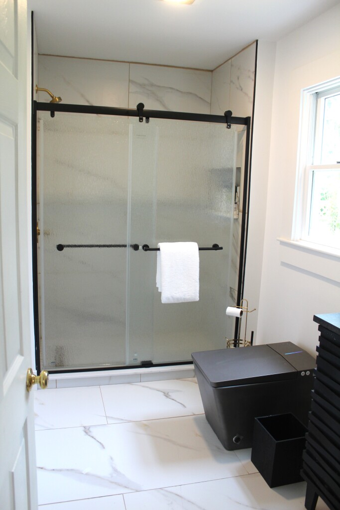 33 Bartlett Road Nantucket, MA 02554 - Photo 12 of 29 a bathroom with a bathtub and a shower