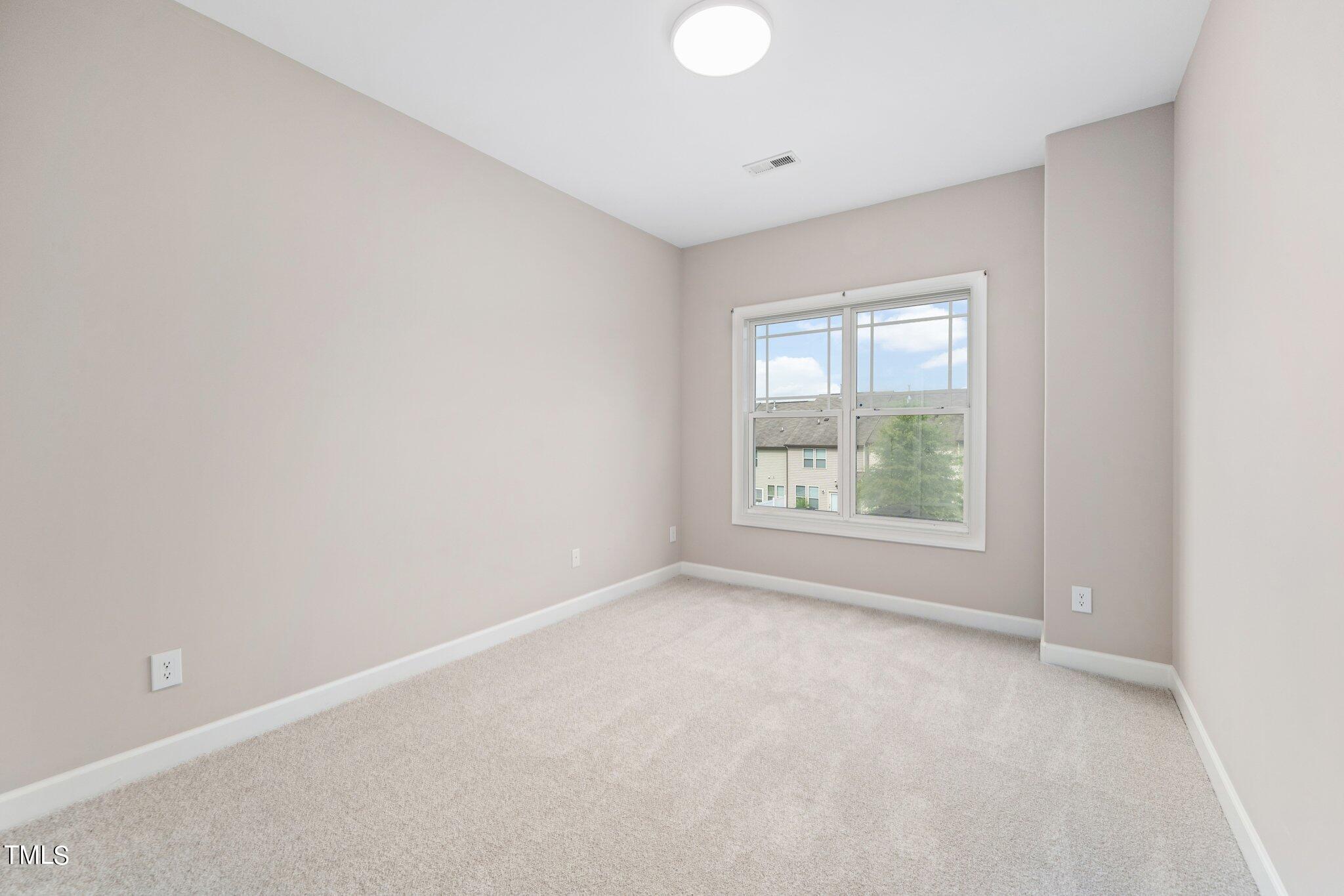 3213 Sunbright Lane Raleigh, NC 27610 - Photo 8 of 25 an empty room with windows