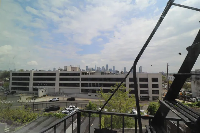 a view of a balcony with furniture