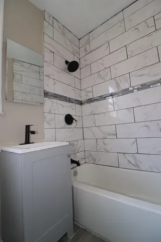 a bathroom with a shower and a bathtub