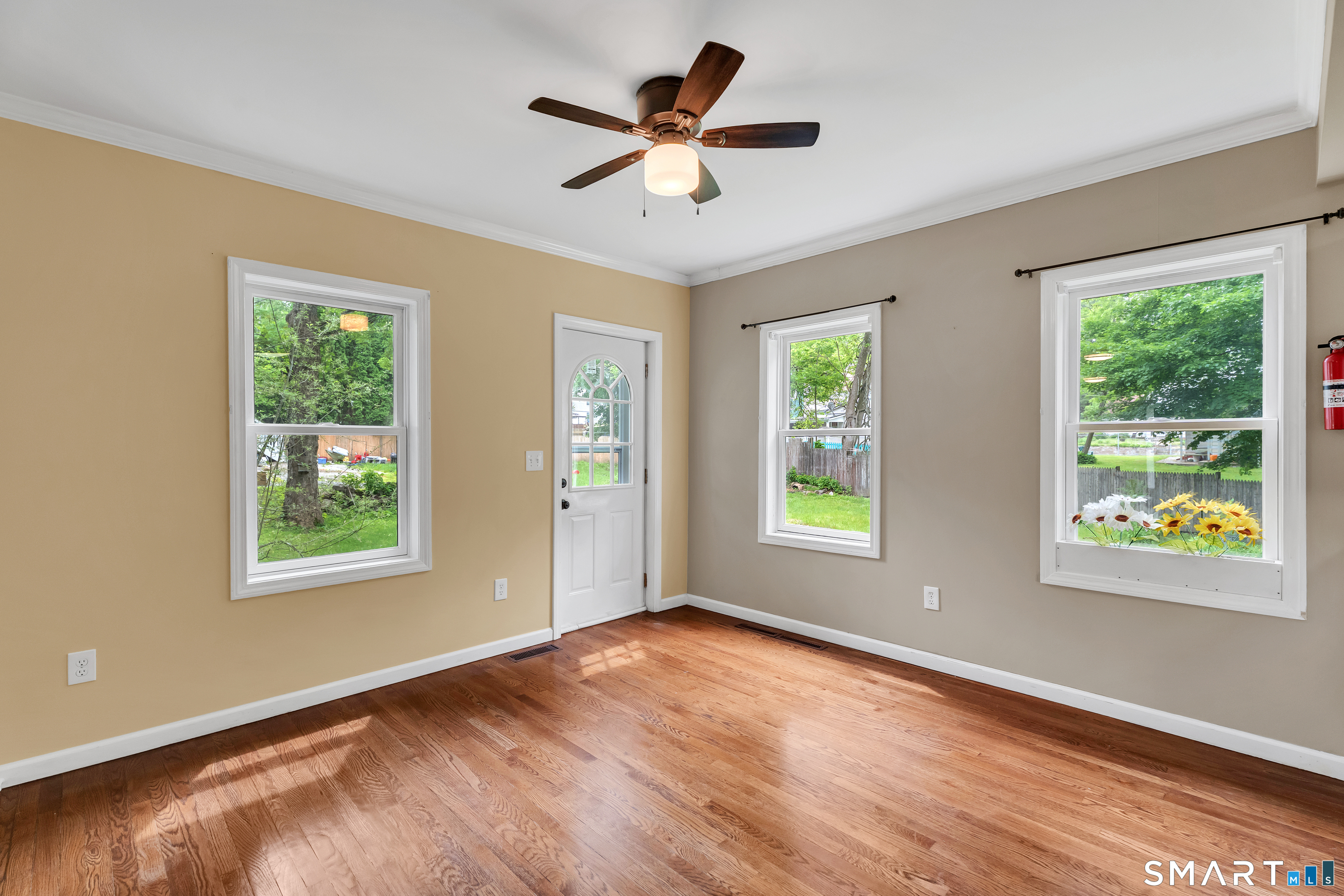 75 Summit Street Norwich, CT 06360 - Photo 24 of 40 a view of an empty room with wooden floor and a window