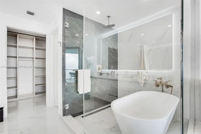 a bathroom with a bathtub and a sink