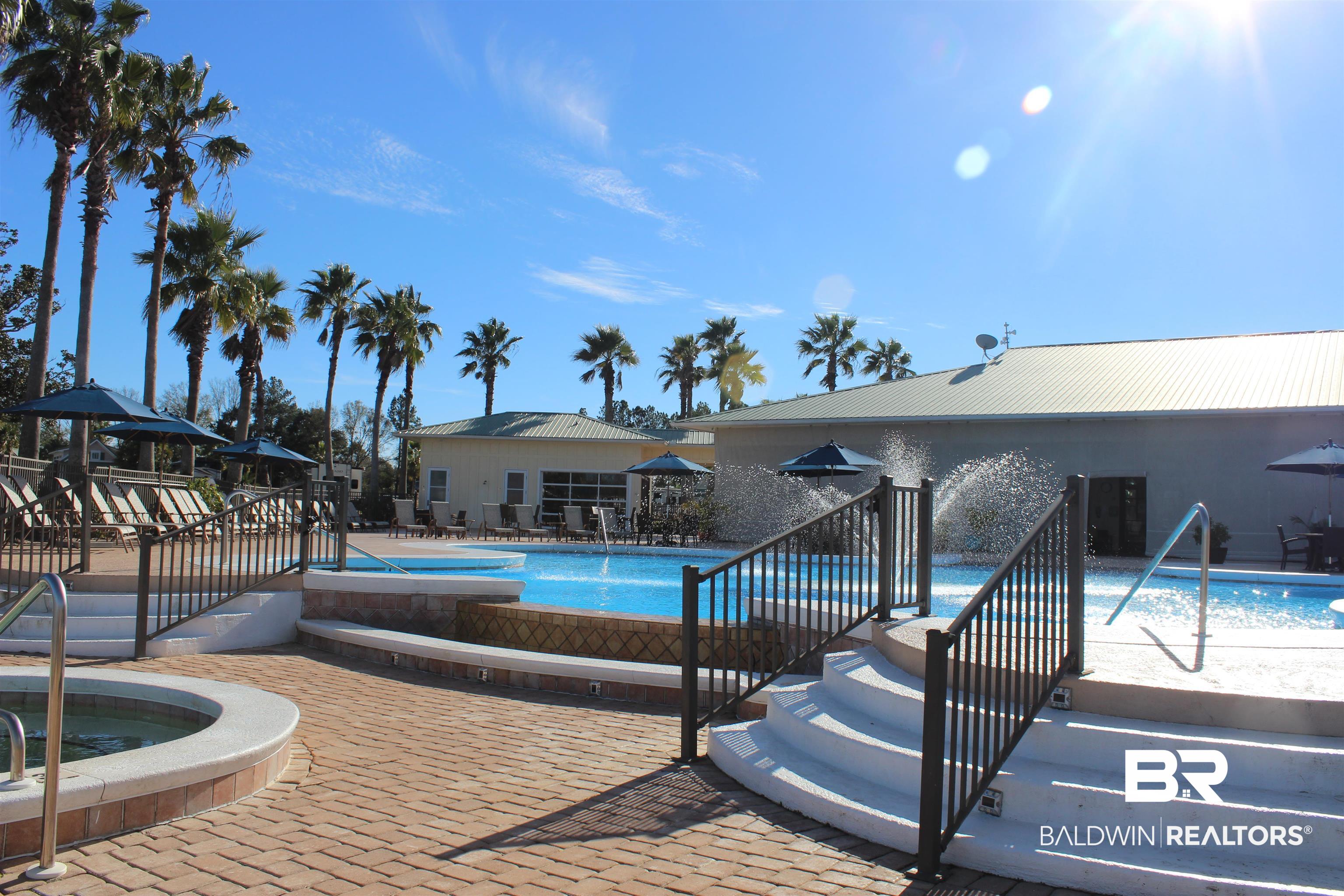 12277 Gateway Drive Elberta, AL 36530 - Photo 27 of 54 Pool with a patio and a community hot tub