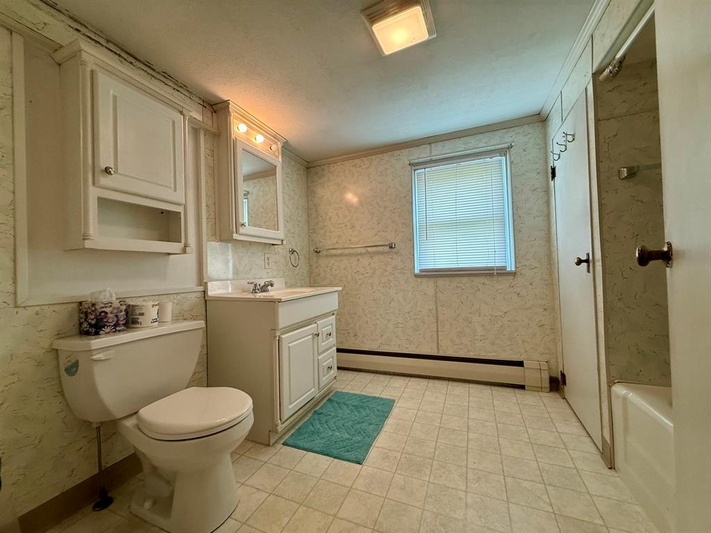 222 Bagdad Road Leechburg, PA 15656 - Photo 22 of 23 a bathroom with a granite countertop toilet a sink and mirror