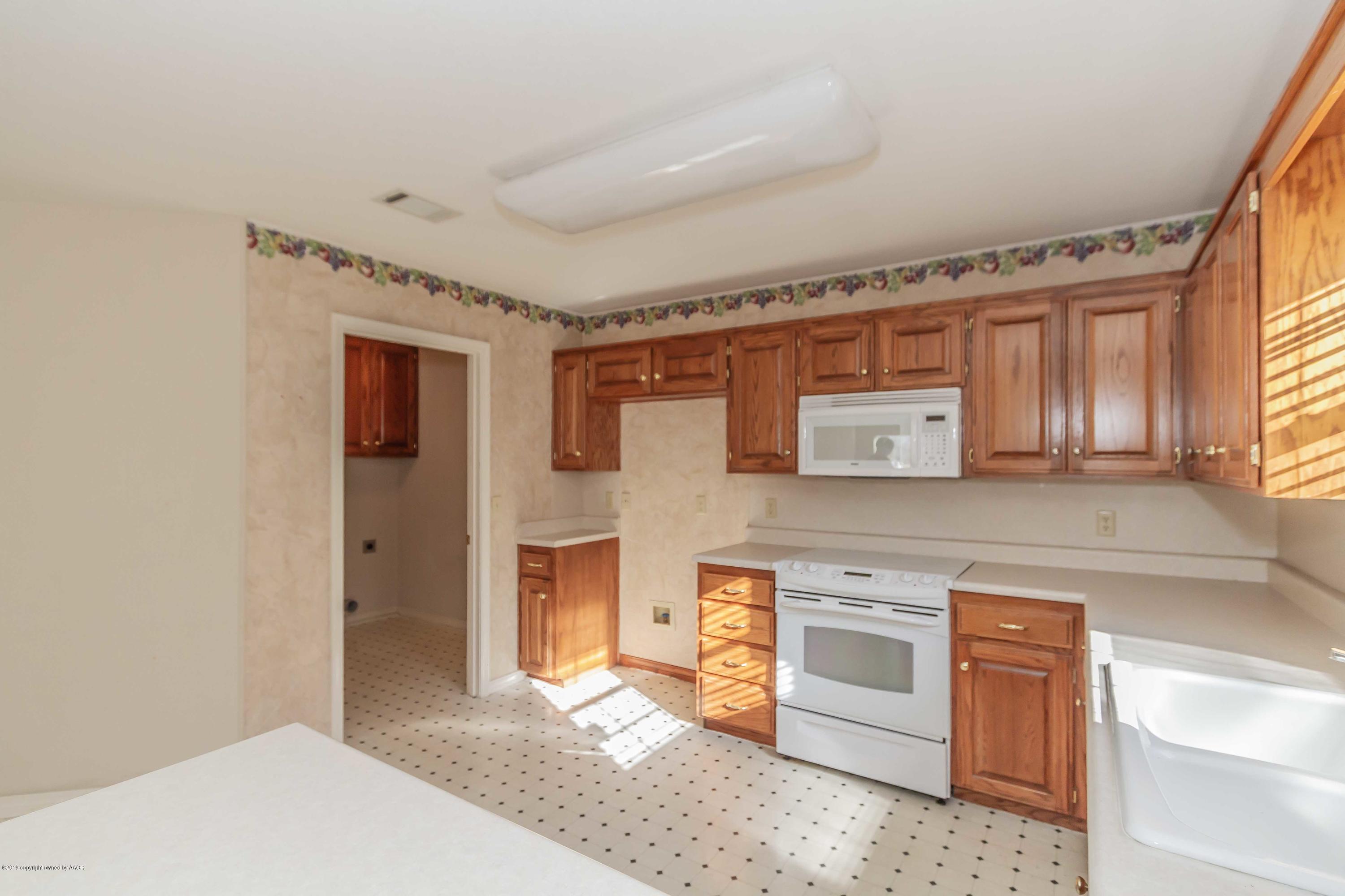7004 Learning Tree Avenue Amarillo, TX 79119 - Photo 9 of 30 KITCHEN VIEW 3