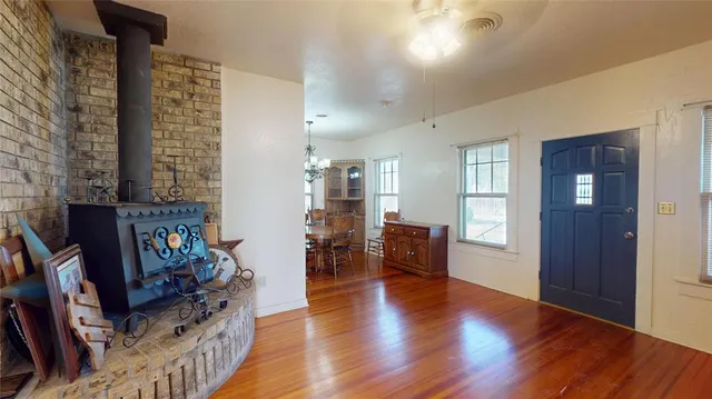 a view of a livingroom with furniture and a hardwood floor