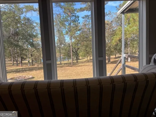 a bathroom with a bathtub and a window