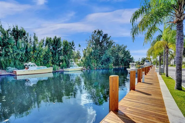 a view of a patio with couches chairs and a fire pit