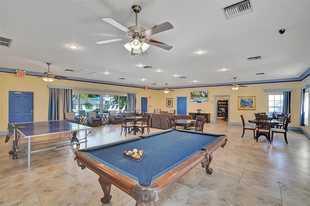 a view of swimming pool with outdoor seating and a patio