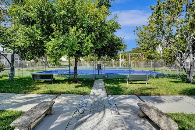 a view of a lake with houses in the back