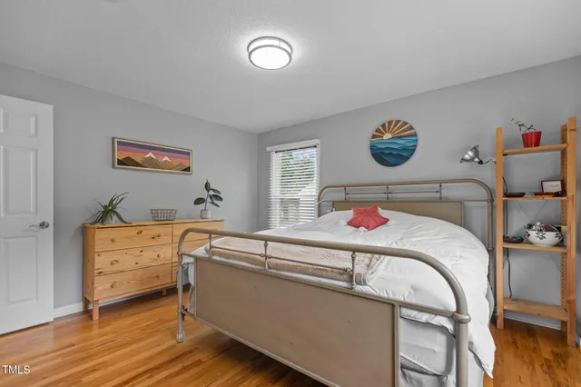 a bedroom with a bed and a table in it