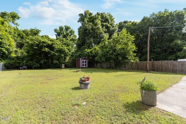 a view of a swimming pool with a yard