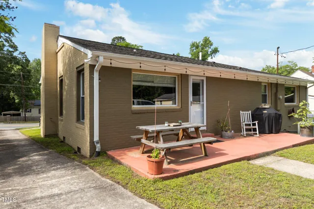 a view of a backyard with a patio