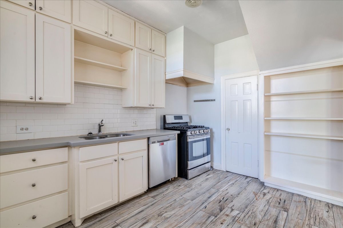 1916 Robbins Place Austin, TX 78705 - Photo 11 of 21 a kitchen with granite countertop white cabinets and white appliances