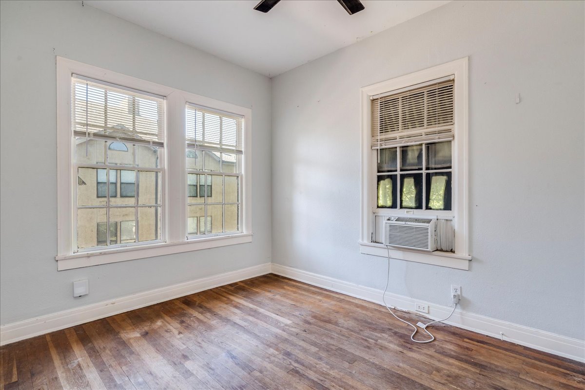 1916 Robbins Place Austin, TX 78705 - Photo 14 of 21 an empty room with wooden floor and windows