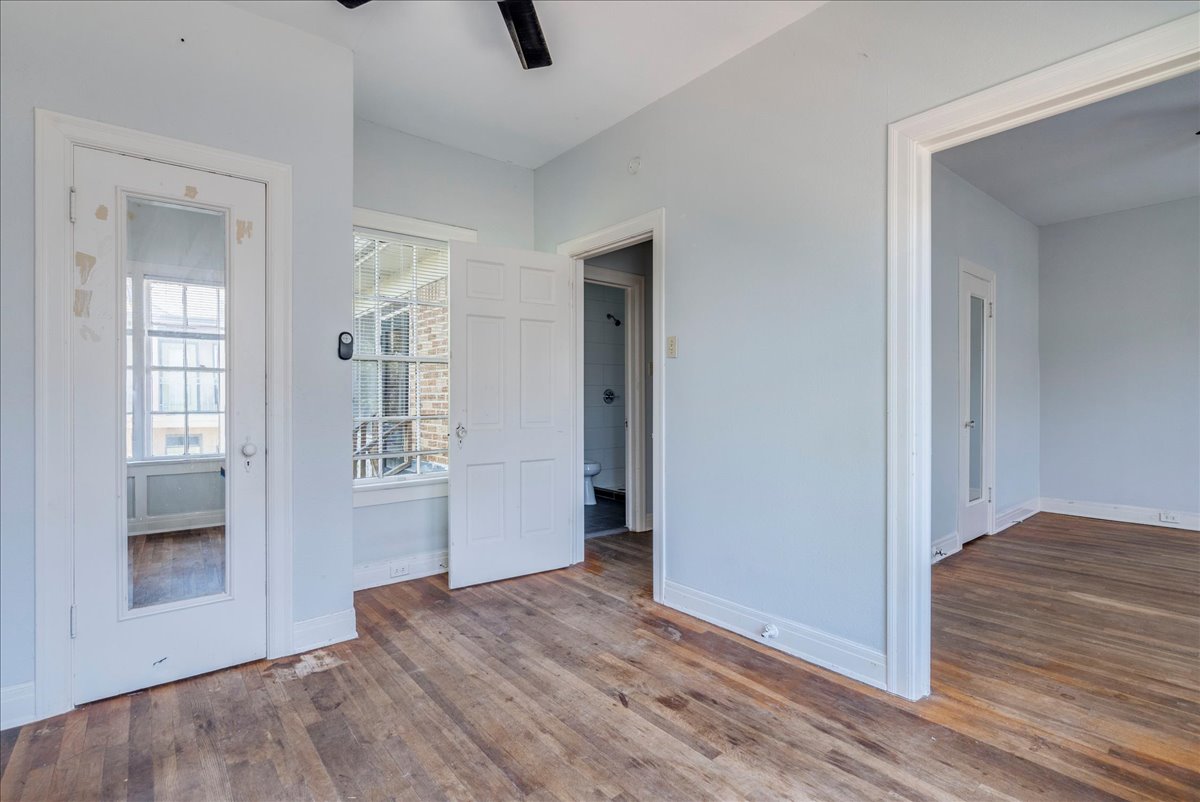1916 Robbins Place Austin, TX 78705 - Photo 15 of 21 an empty room with wooden floor and windows