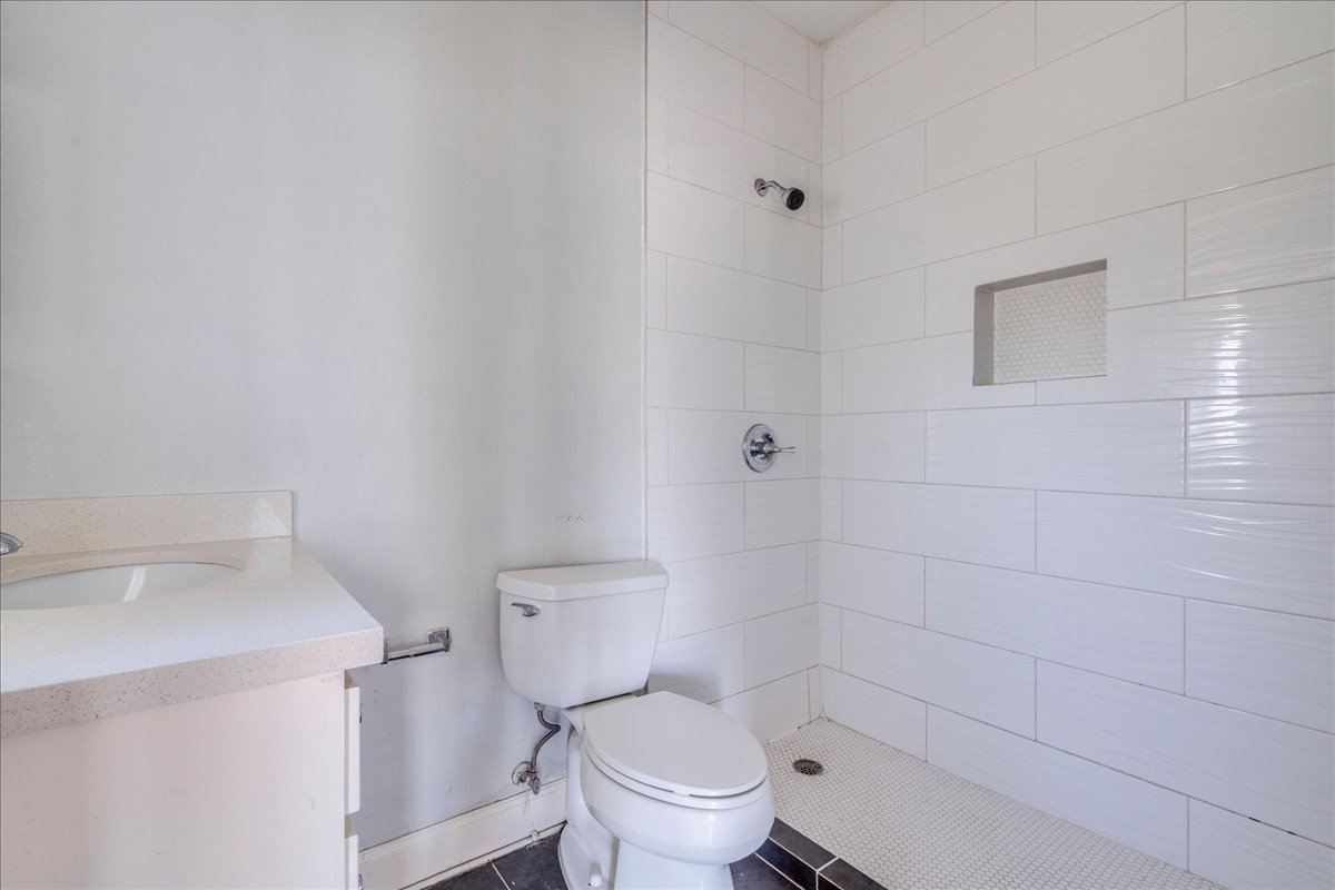 1916 Robbins Place Austin, TX 78705 - Photo 4 of 21 a white toilet sitting next to a bathroom sink