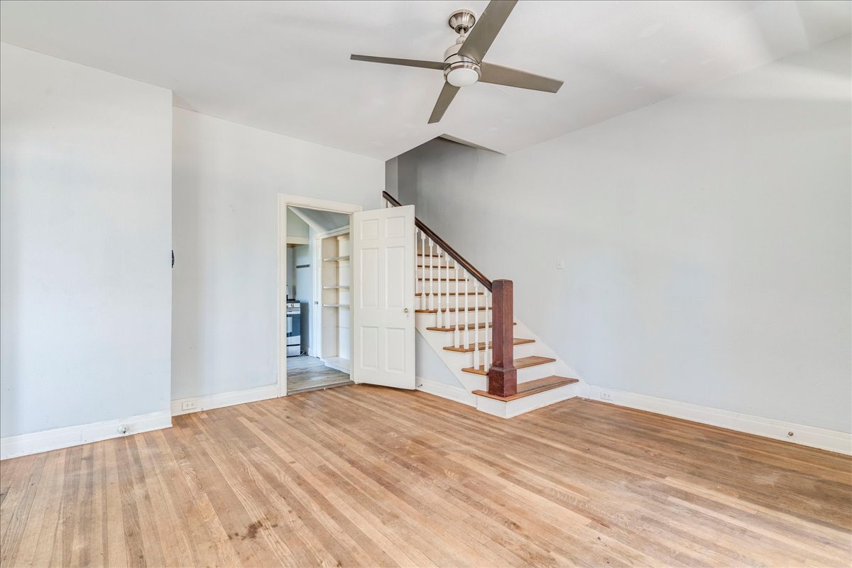 1916 Robbins Place Austin, TX 78705 - Photo 5 of 21 a view of a big room with wooden floor and stairs