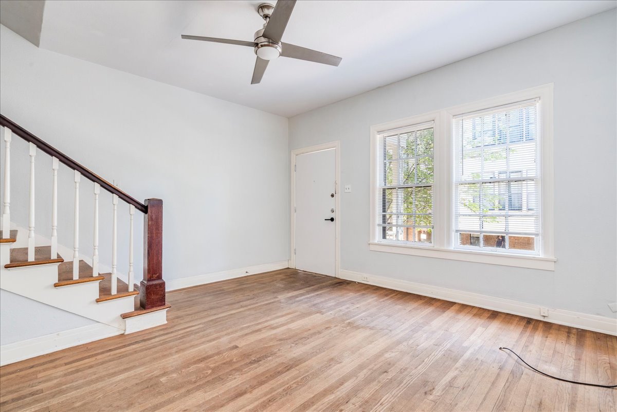1916 Robbins Place Austin, TX 78705 - Photo 6 of 21 an empty room with wooden floor and windows