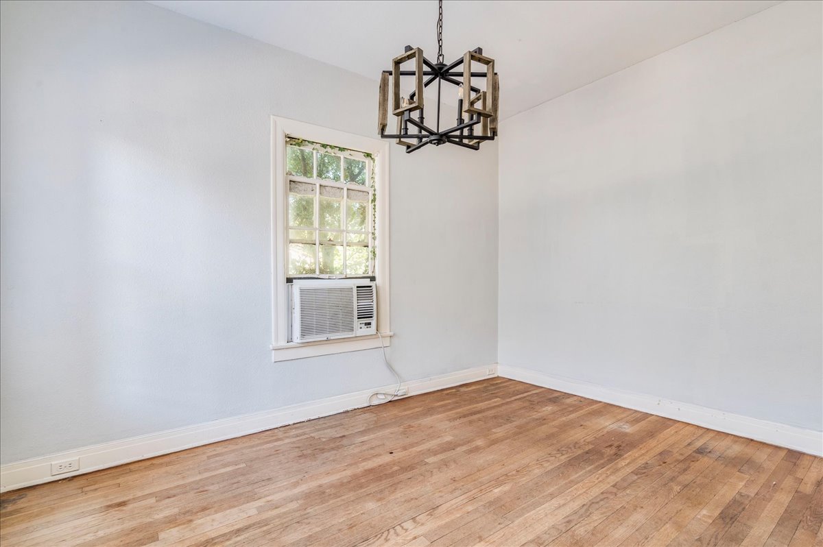 1916 Robbins Place Austin, TX 78705 - Photo 7 of 21 a view of empty room with wooden floor and fan