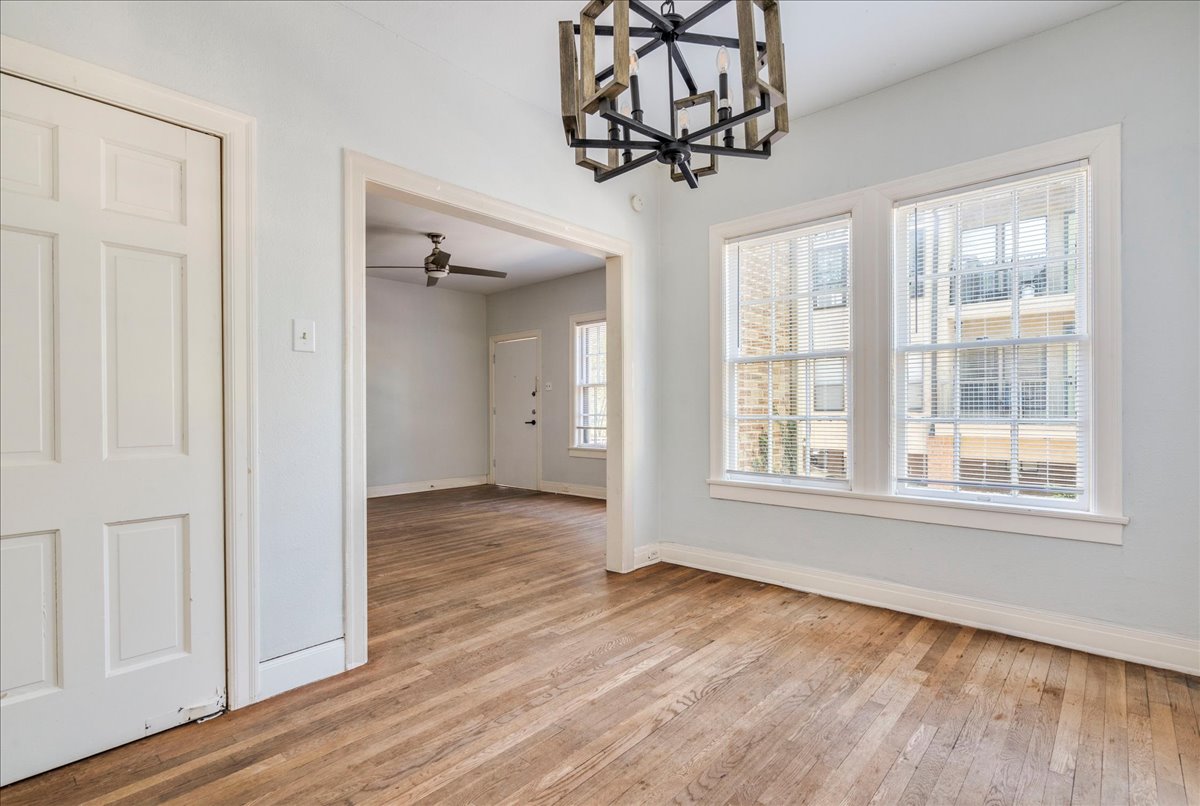 1916 Robbins Place Austin, TX 78705 - Photo 8 of 21 a view of an empty room with wooden floor and a window