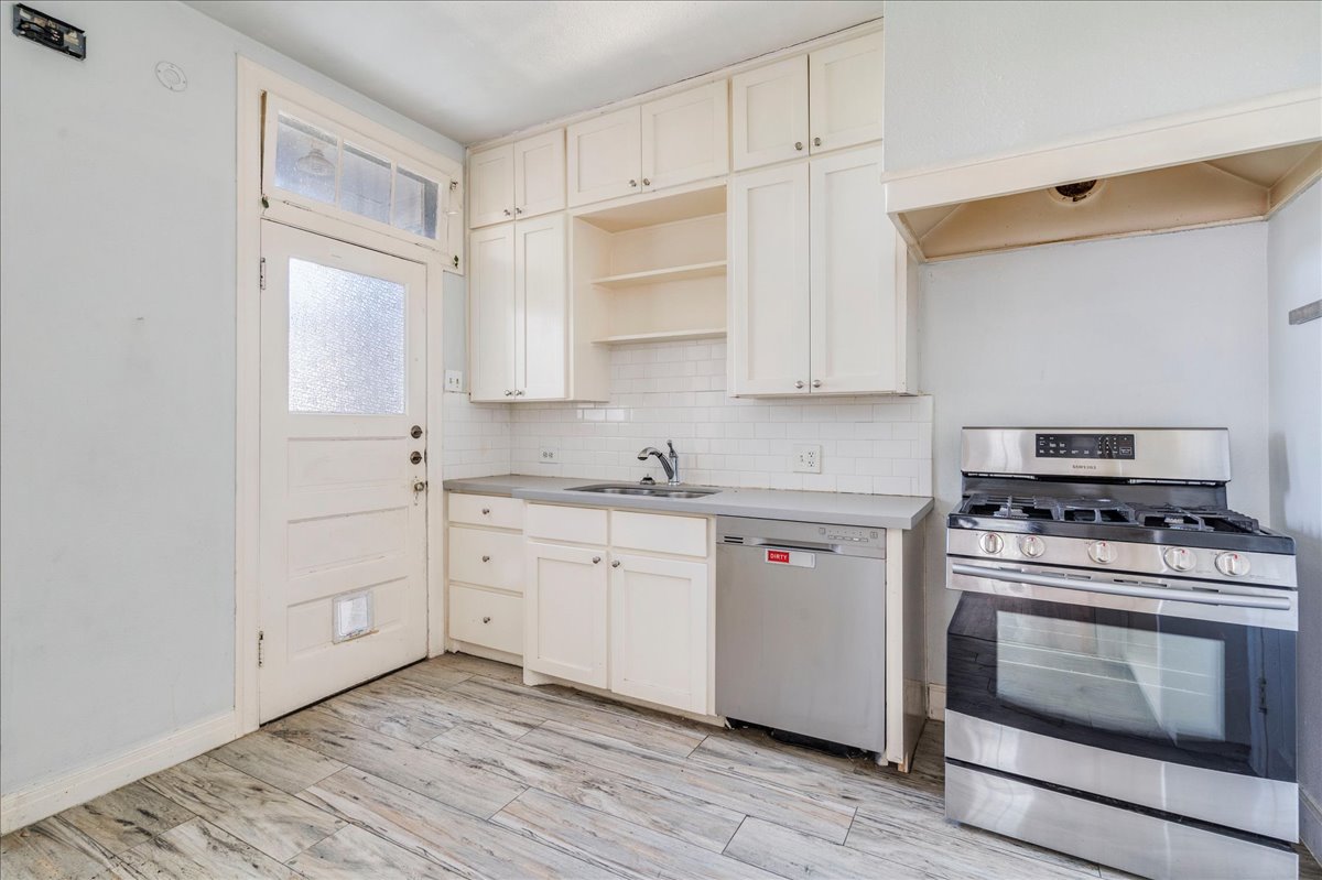 1916 Robbins Place Austin, TX 78705 - Photo 10 of 21 a kitchen with cabinets appliances and wooden floor