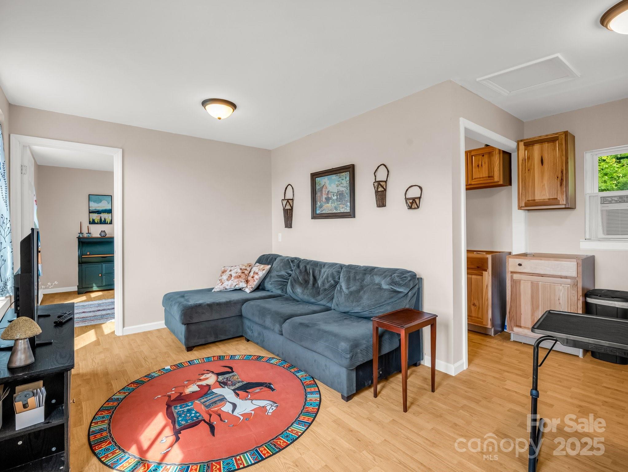847 Crowe Dairy Road Forest City, NC 28043 - Photo 12 of 35 a living room with furniture and a wooden floor