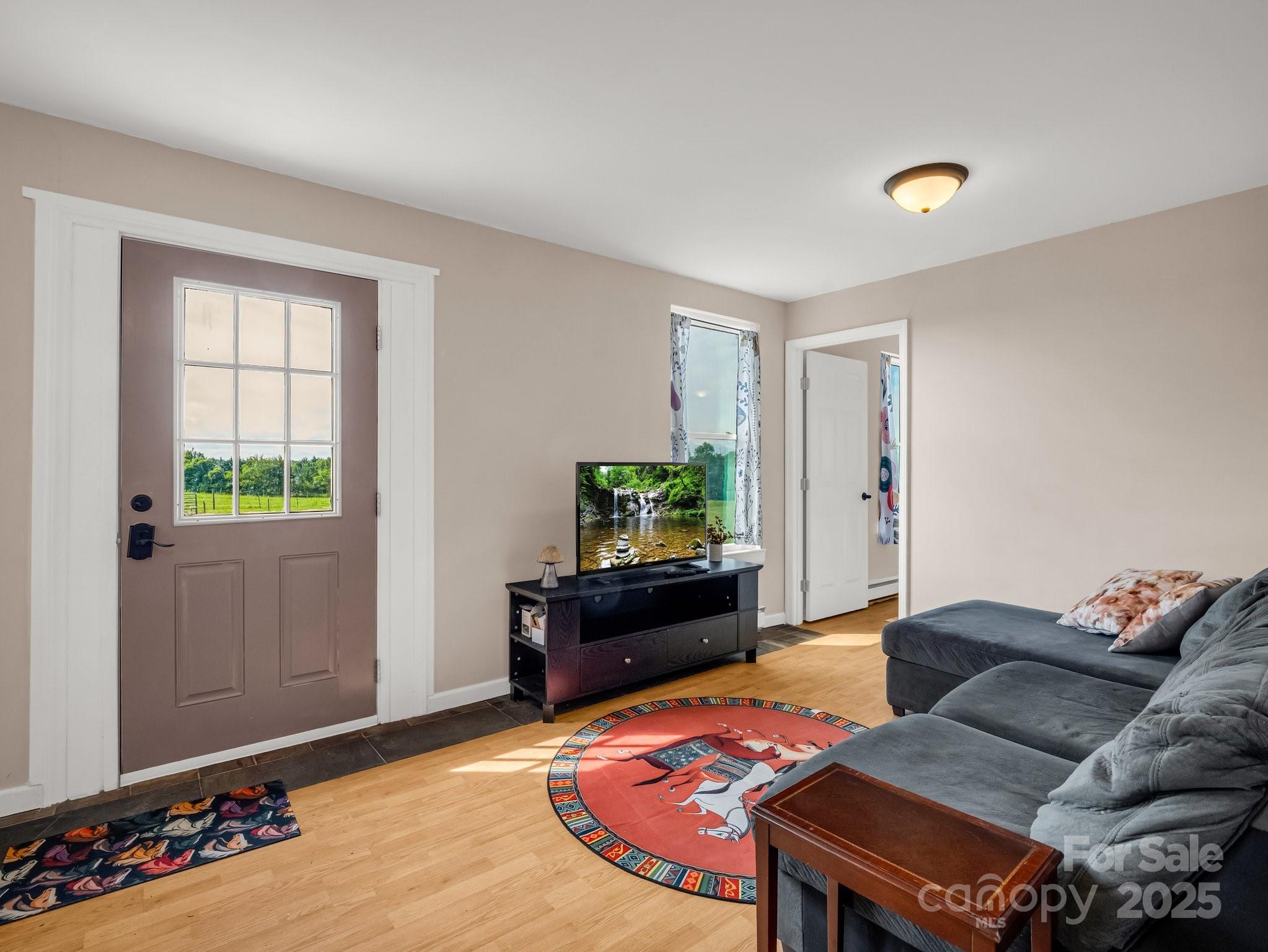 847 Crowe Dairy Road Forest City, NC 28043 - Photo 13 of 35 a living room with furniture and a flat screen tv