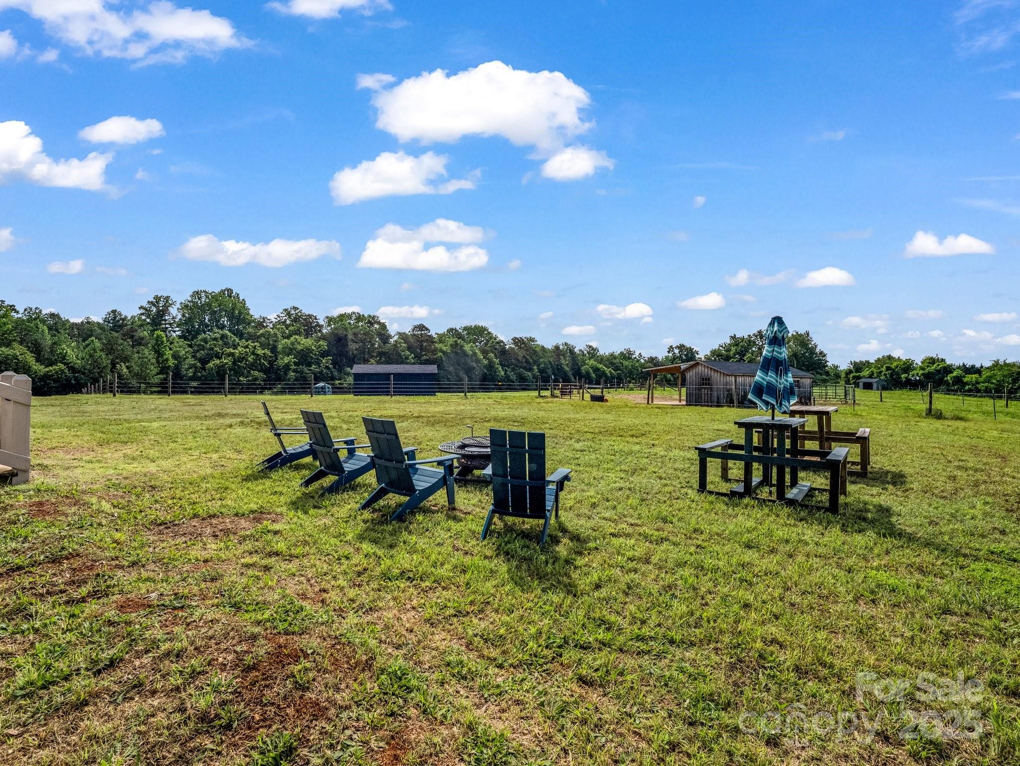 847 Crowe Dairy Road Forest City, NC 28043 - Photo 2 of 35 a view of a lake with a table and chairs