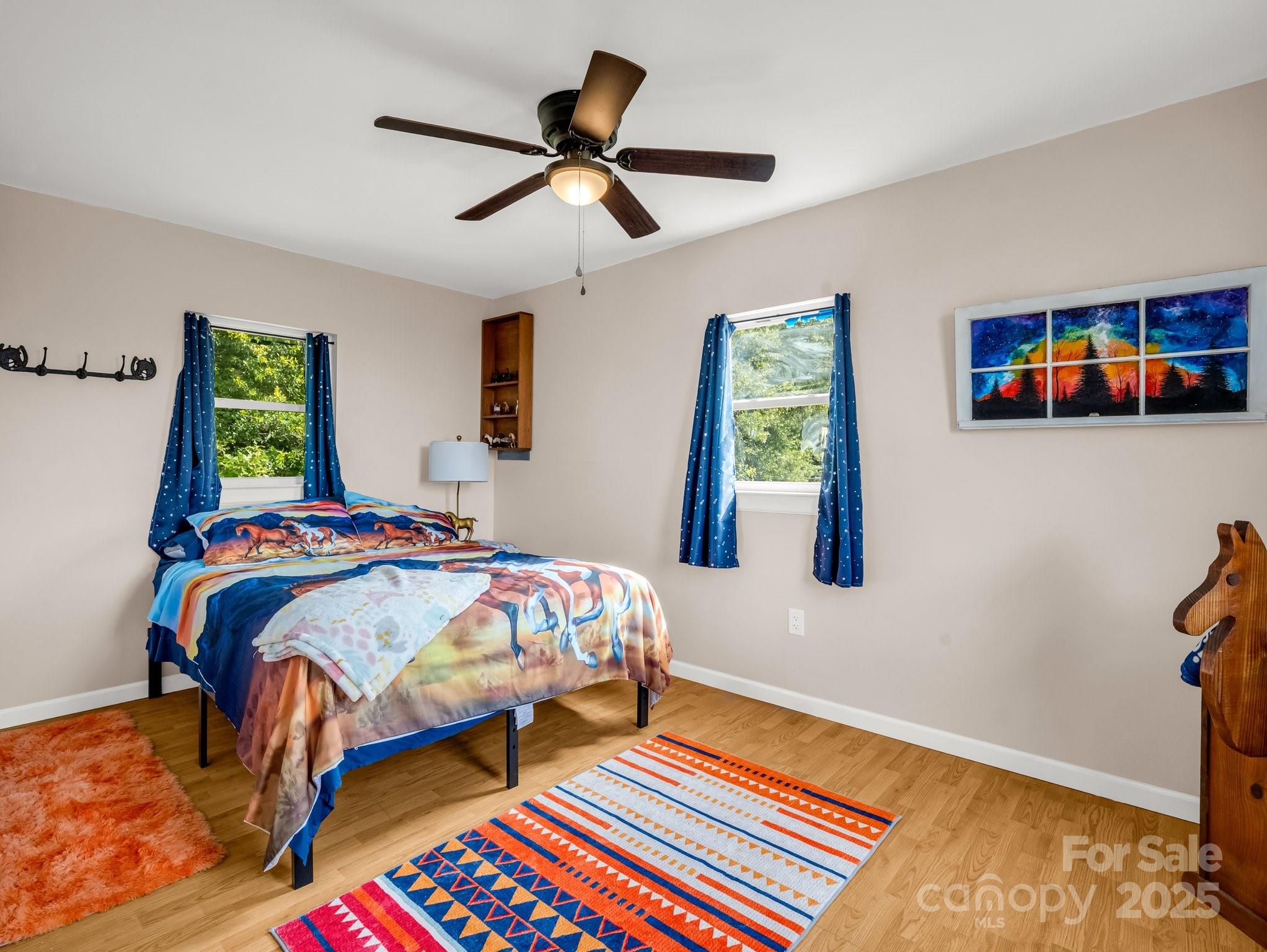 847 Crowe Dairy Road Forest City, NC 28043 - Photo 21 of 35 a bedroom that has a bed and a table in it