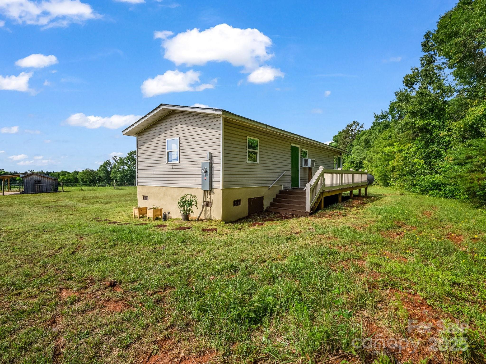 847 Crowe Dairy Road Forest City, NC 28043 - Photo 33 of 35 a front view of a house with garden
