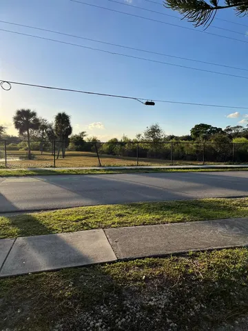 a kitchen with a stove sink and cabinets