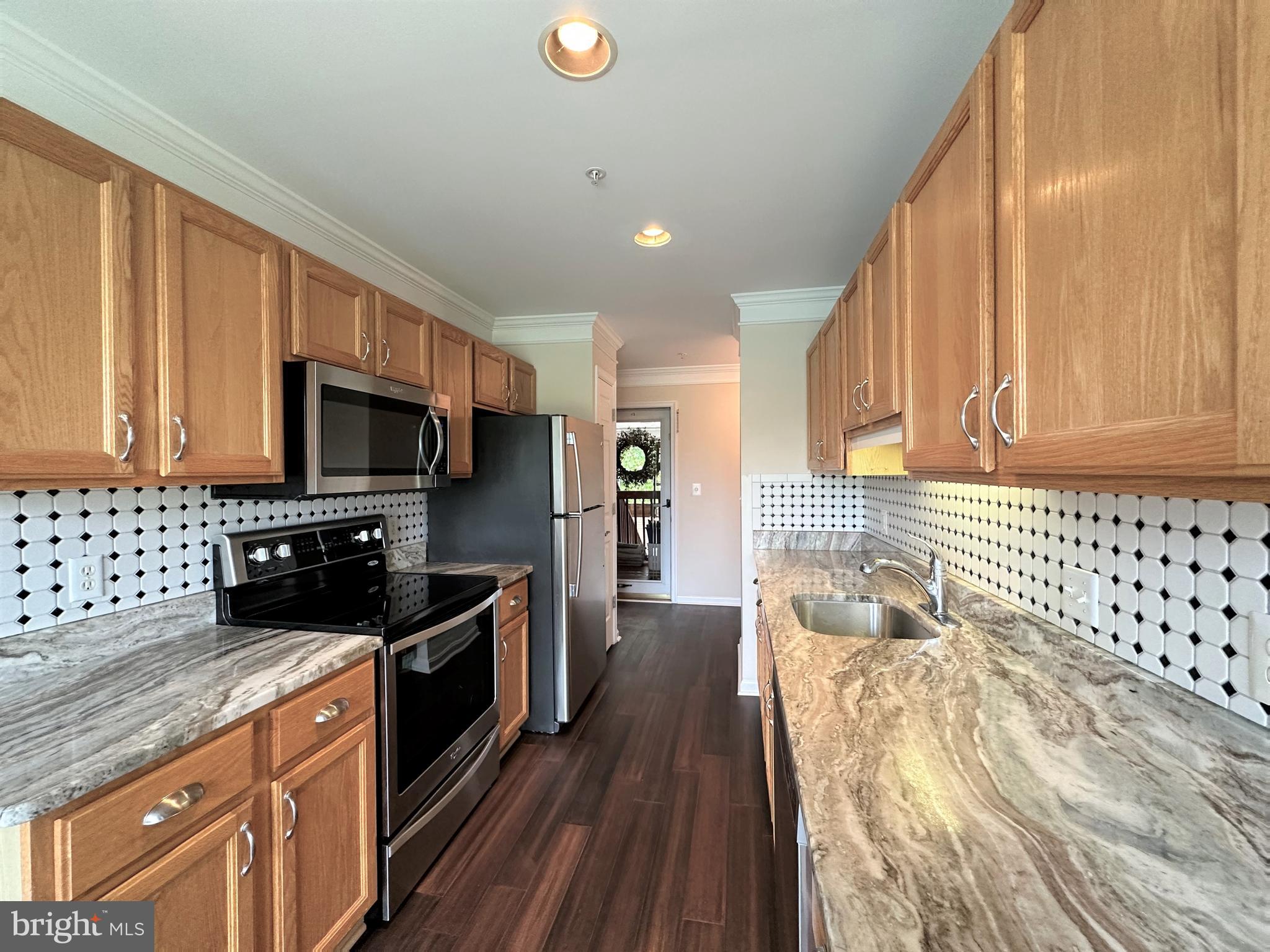312 Teal Court, Unit F Chester, MD 21619 - Photo 6 of 25 Kitchen with granite countertops