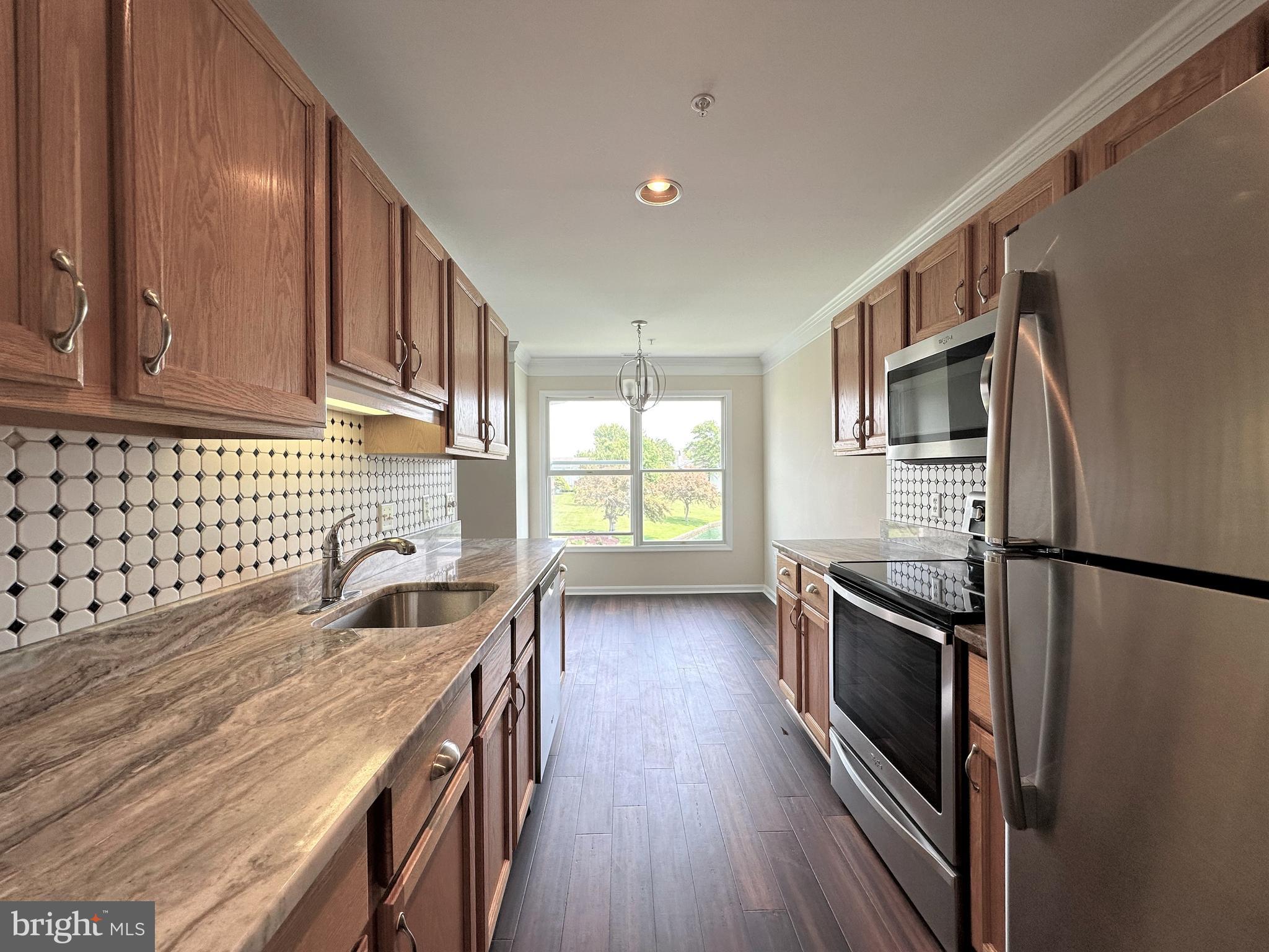 312 Teal Court, Unit F Chester, MD 21619 - Photo 7 of 25 Kitchen with dining area