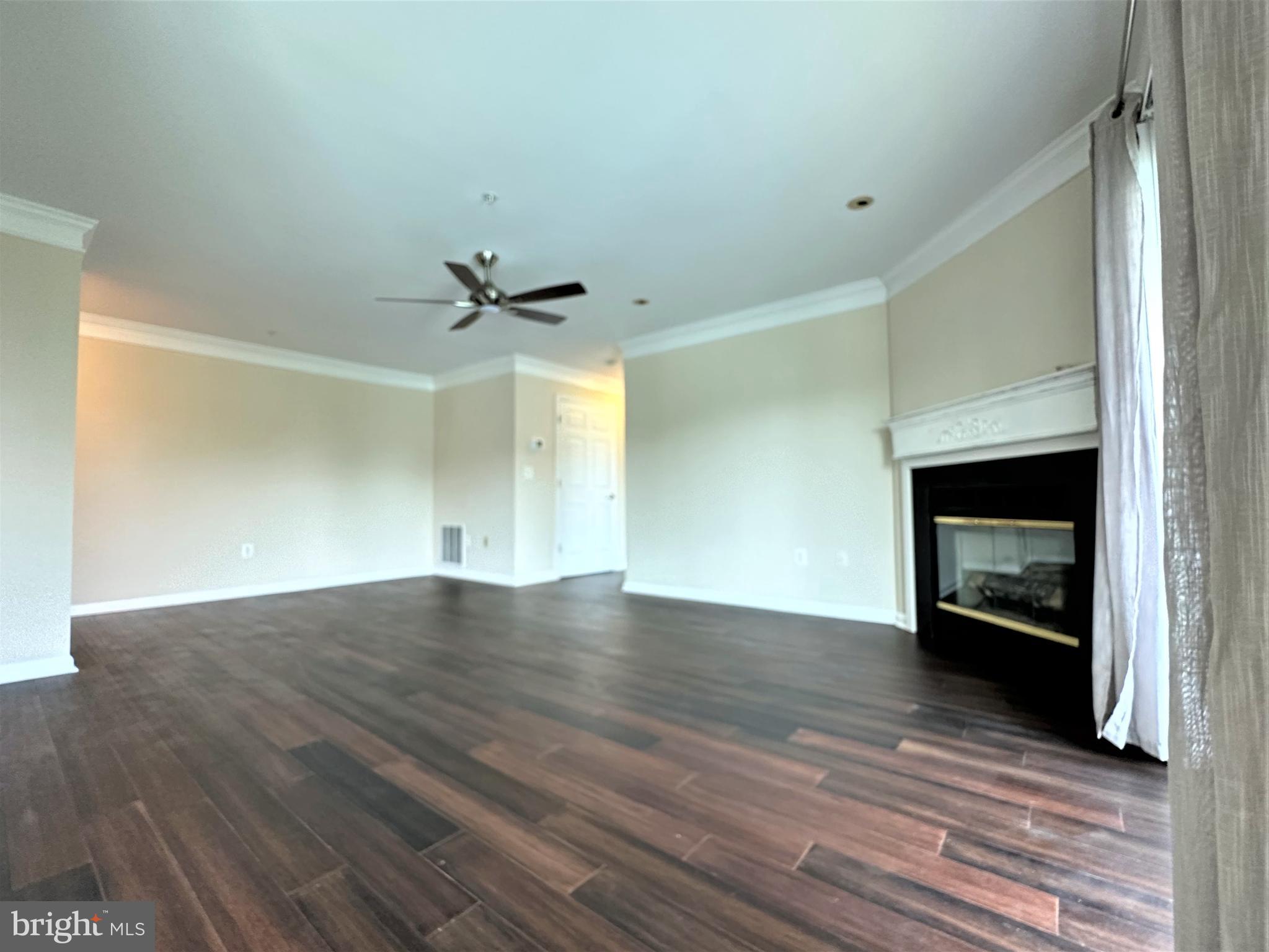 312 Teal Court, Unit F Chester, MD 21619 - Photo 8 of 25 Living room with FP