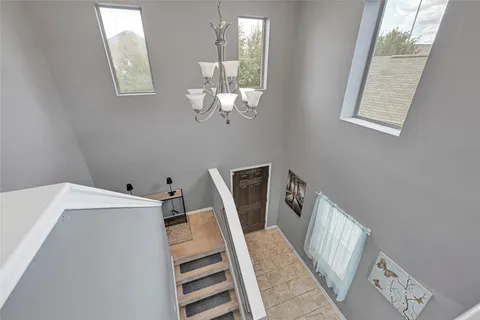 a view of a hallway with windows