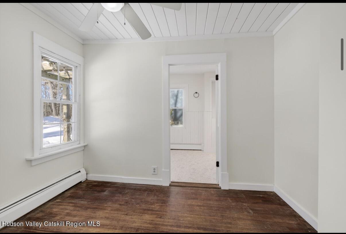 919 Elting Road Rosendale, NY 12472 - Photo 11 of 28 an empty room with wooden floor and windows